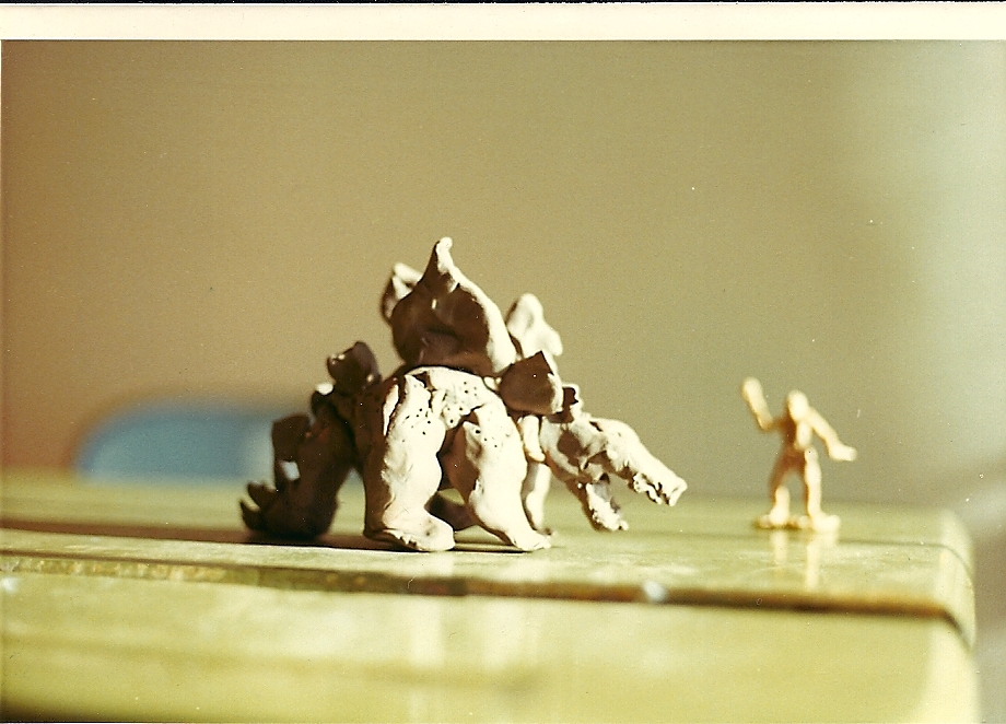 A dino and a cheesus gasx caveman with a The Who album